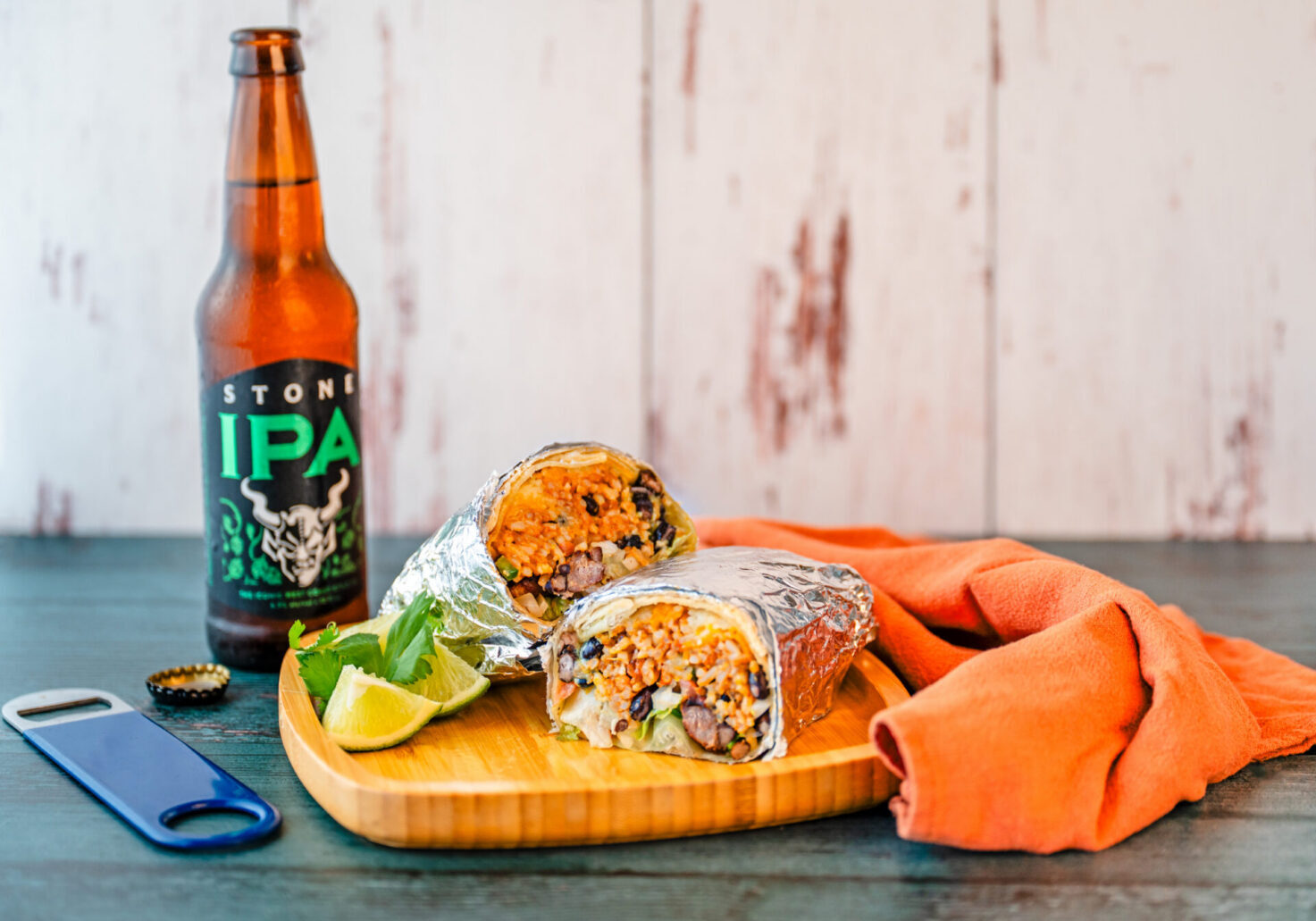 Burrito and IPA beer on table